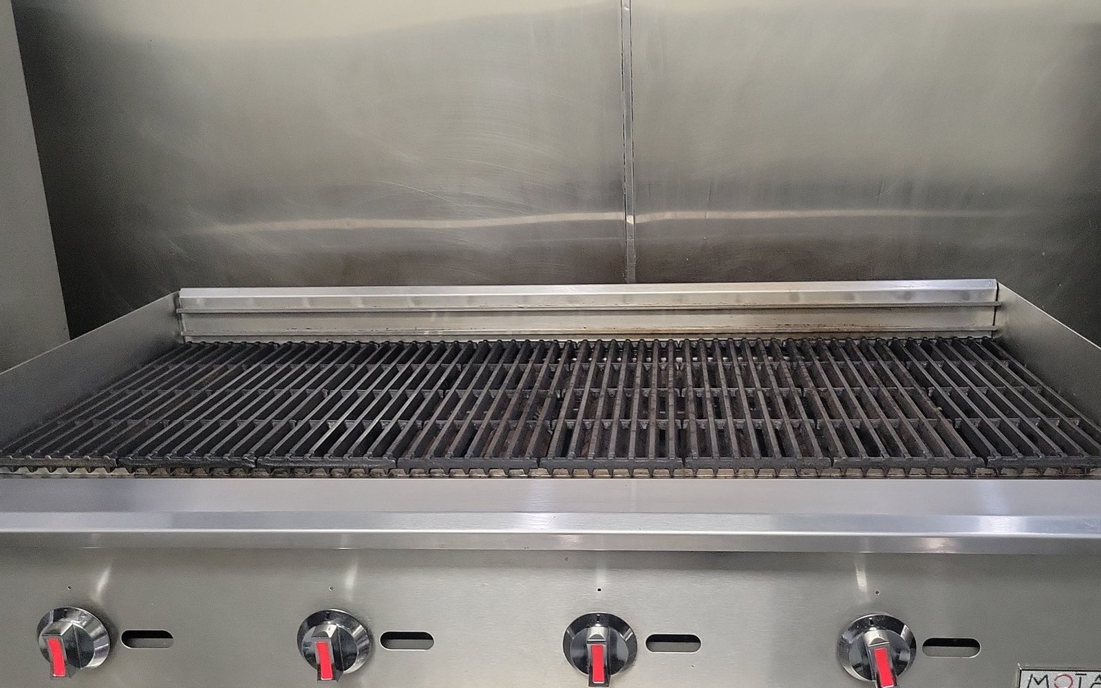 A four-burner charbroiler on a Cooking Block cookline